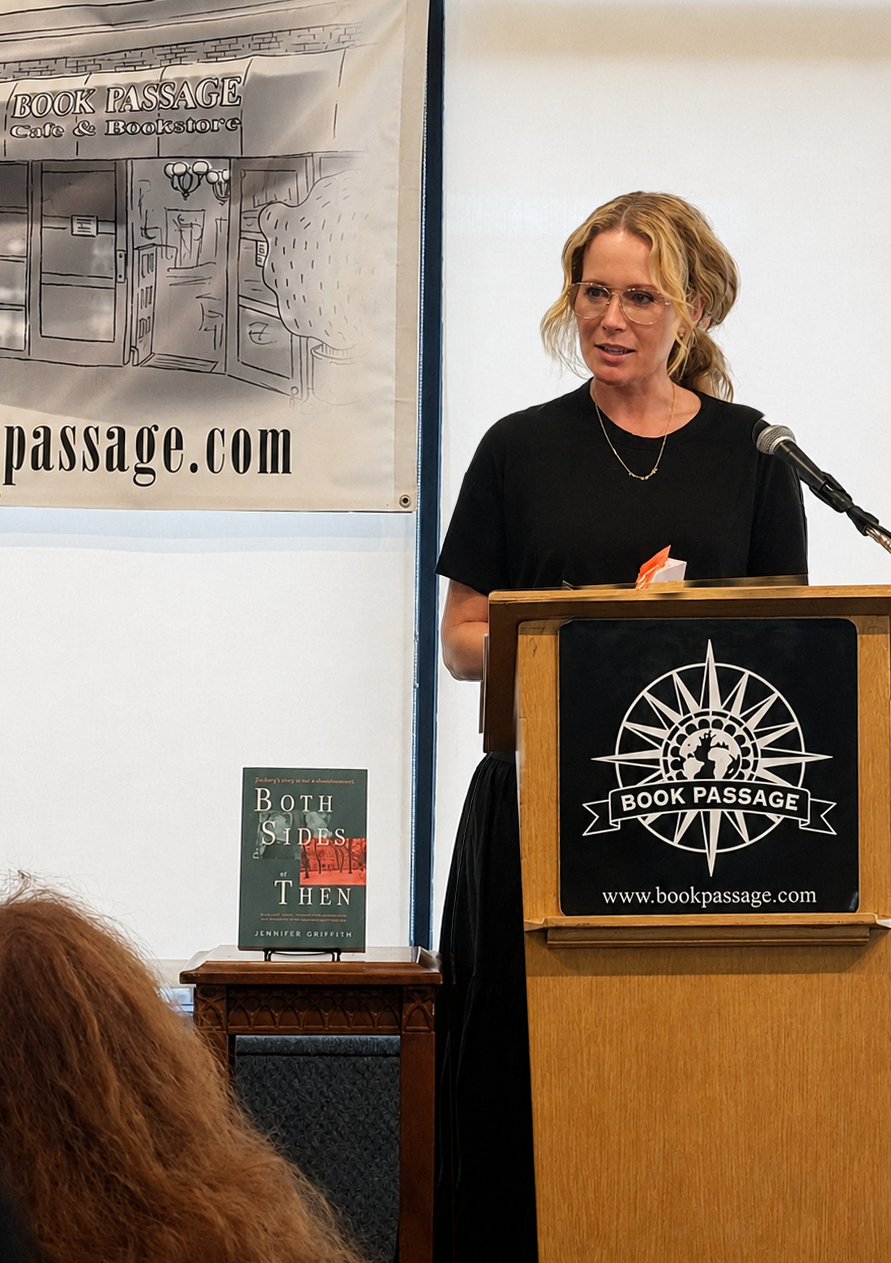 Jennifer standing at a podium for the Book Passage event.